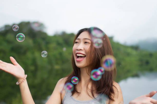 istock Thai girl smile  and happy with air bubbles 901568198
