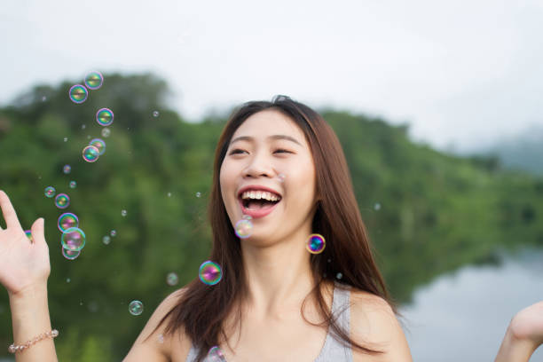 istock Thai girl smile  and happy with air bubbles 901568254