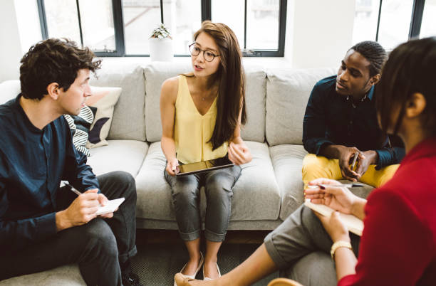 istock Group of Young Entrepreneurs Working Together Taking Notes 901570754