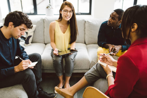 istock Group of Young Entrepreneurs Working Together Taking Notes 901570802
