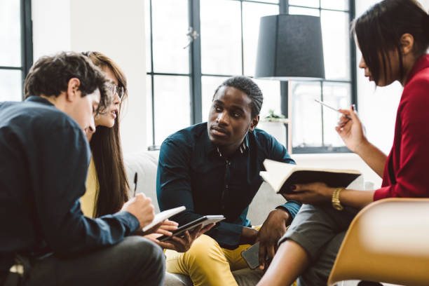 istock Young Black Entrepreneur Paying Attention at Meeting 901570842
