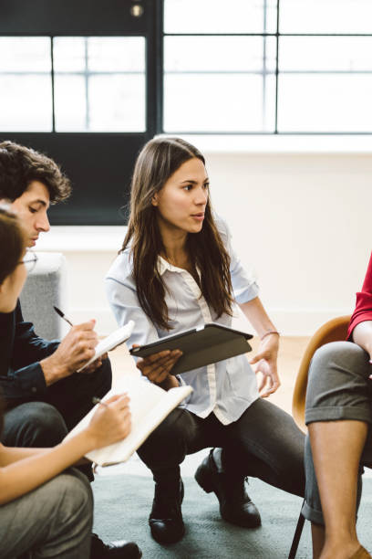 istock Female Leader in the Middle of Explaining Details 901570898