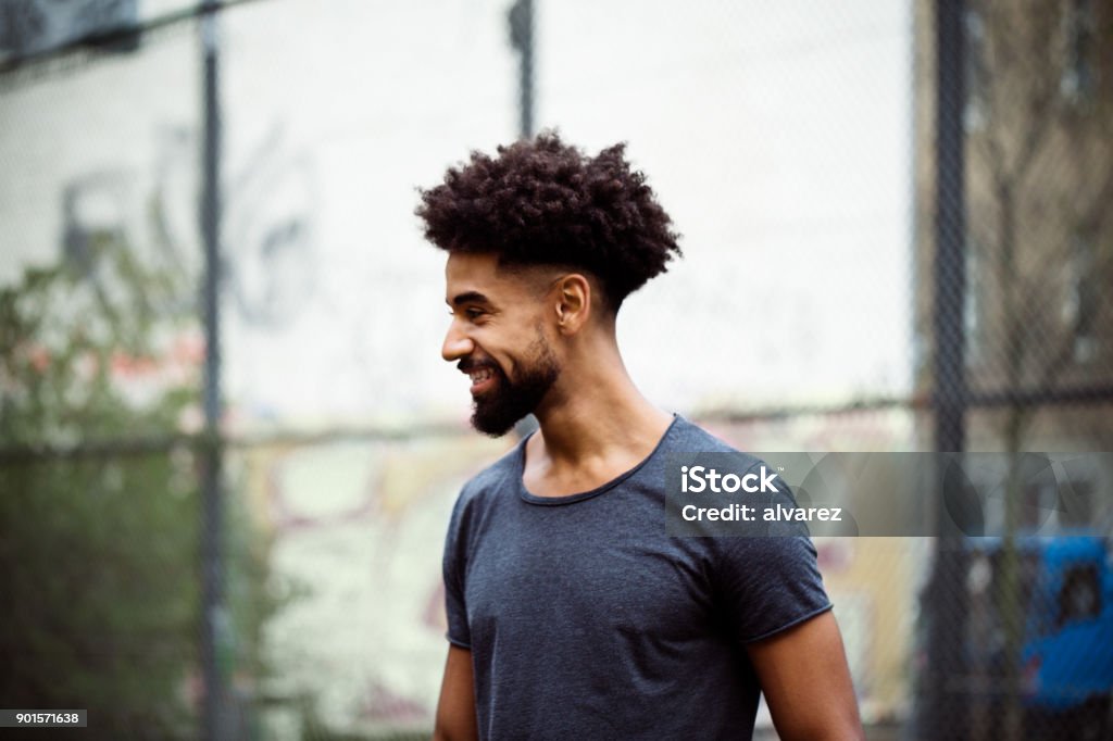 Smiling Player With Frizzy Hair Looking Away Stock Photo - Download Image  Now - Men, African-American Ethnicity, Beard - iStock