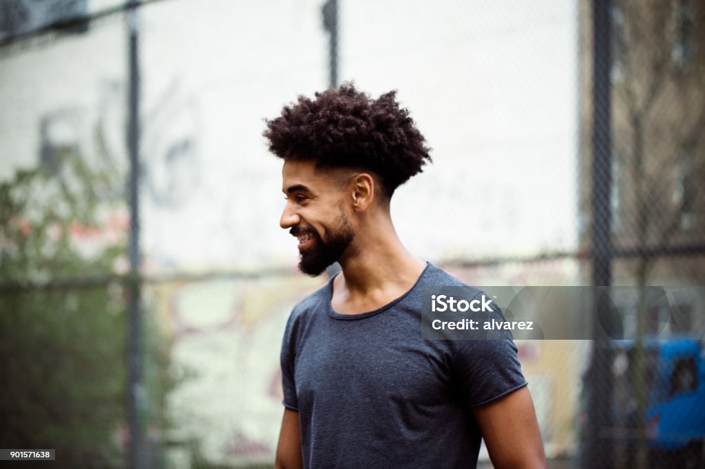 Smiling Player With Frizzy Hair Looking Away Stock Photo - Download Image Now - Men, African-American Ethnicity, Beard - iStock Smiling Player With Frizzy Hair Looking Away Stock Photo - Download Image Now - Men, African-American Ethnicity, Beard - iStock