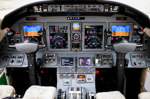 Close up view of airplane dashboard inside the cockpit.