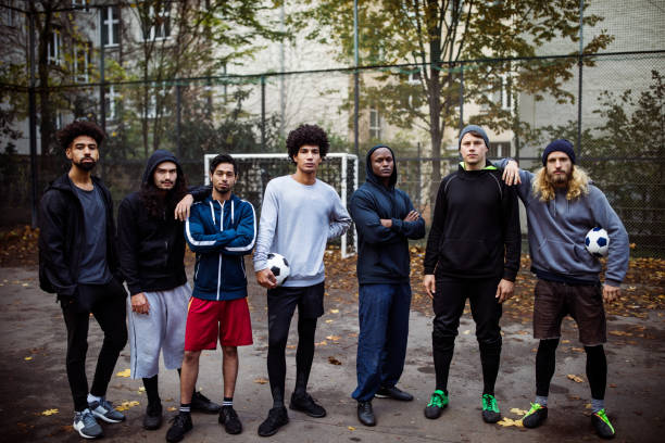 istock Confident soccer team standing on street 901574924