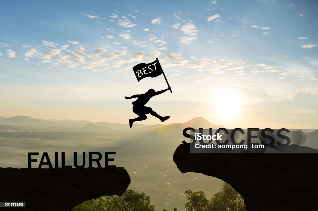 Men jump over silhouette hand hold flag best failure Committed to success. Failure Stock Photo