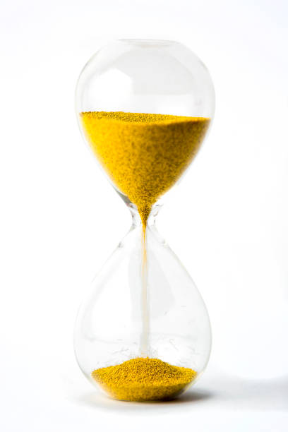 istock hourglass with gold beads on white background 901580234