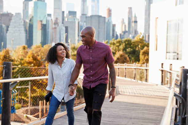 istock Couple Visiting New York With Manhattan Skyline In Background 901584428