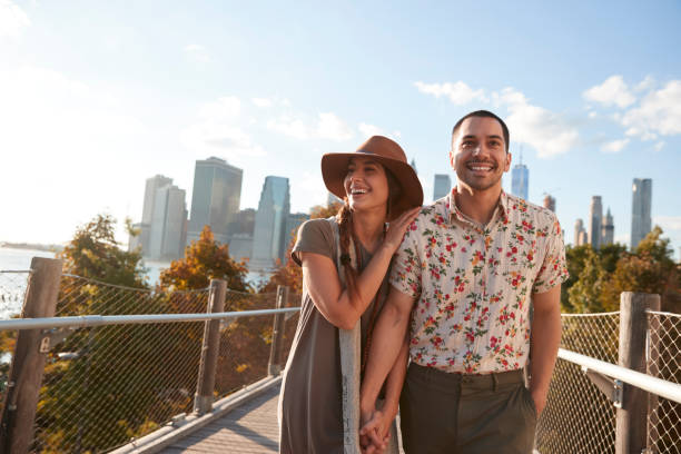 istock Couple Visiting New York With Manhattan Skyline In Background 901587338