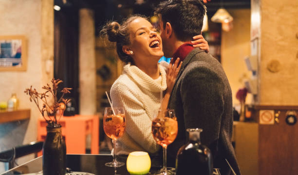 istock Flirting couple in bar 901587928