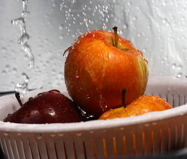 Washing apples stock photo