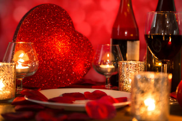 istock Valentine's Day romantic candlelight dinner with heart gift and wine. 901591986