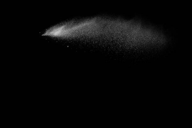istock Launched white powder splash on black background. Bizarre forms of of white powder explosion cloud against dark background. 901594862