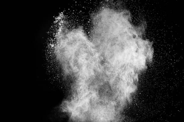 istock Launched white powder splash on black background. Bizarre forms of of white powder explosion cloud against dark background. 901594914