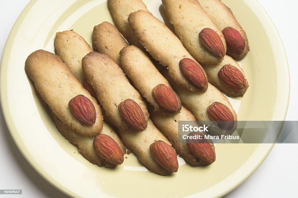 Close-up of finger shape Halloween cookies with almond nuts Halloween cookies "Witch's fingers", made in the shape of cut woman's fingers. Cookie Stock Photo