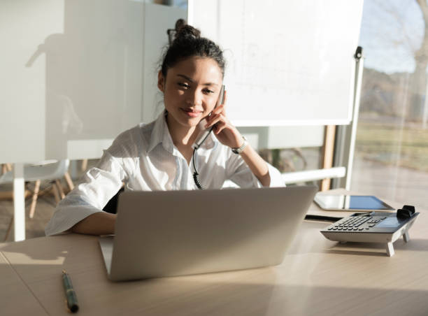 istock Asian woman working with laptop in office 901595774