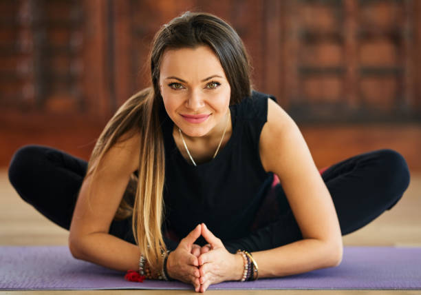 istock Young woman yoga trainer 901595938