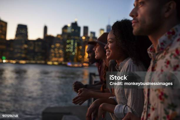 Group Of Young Friends On Trip To Manhattan At Dusk Stock Photo - Download Image Now