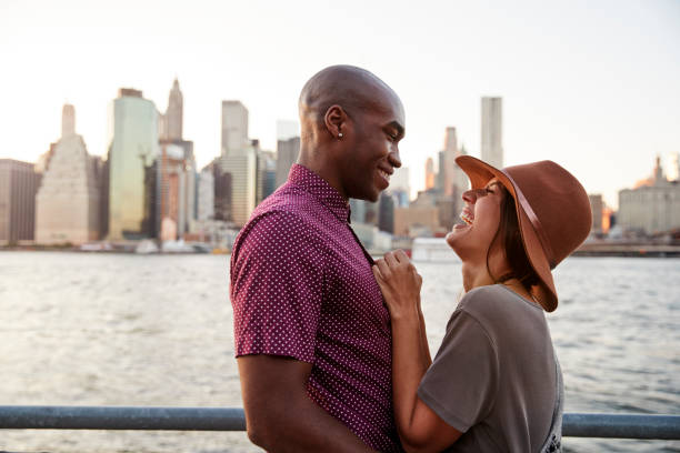 istock Romantic Young Couple With Manhattan Skyline In Background 901596150