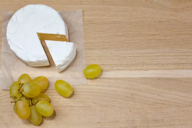 Photo of Camembert cheese and grapes