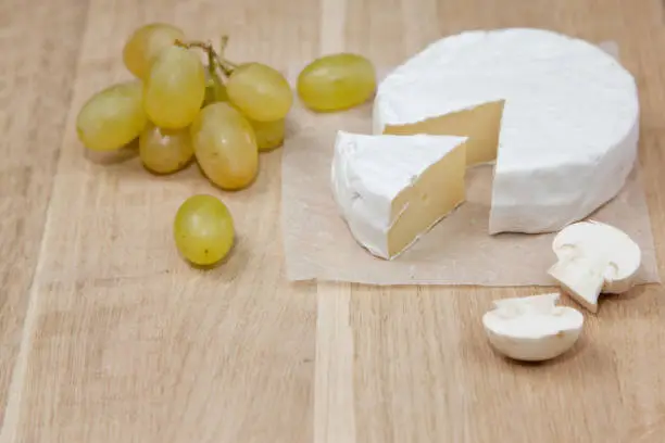 Photo of Camembert cheese and grapes