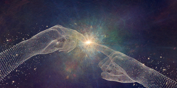 A conceptual image of a pair of hands formed form many multi coloured spheres with index fingers outstretched near point of touching in similar pose to Michelangelo's painting 'Creation Of Adam'. At the point of contact there is a bright light and swirling colours which could depict energy, light or intelligence.