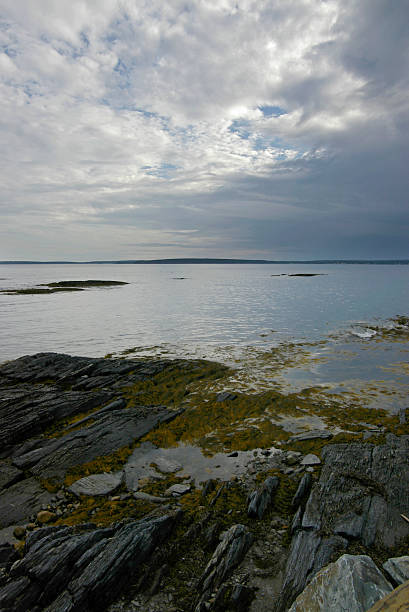 blue rocks and dramatic sky stock photo