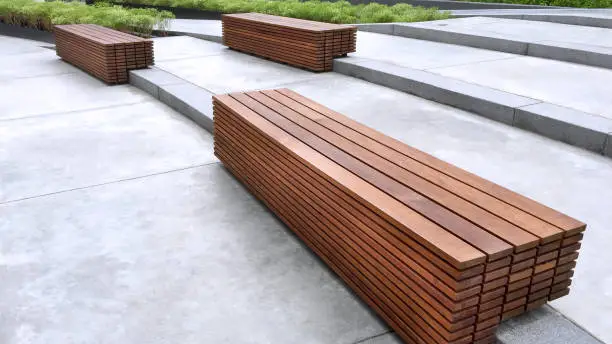 Brown Wooden Benches on Floor Steps in the Park Made of Stacked Planks