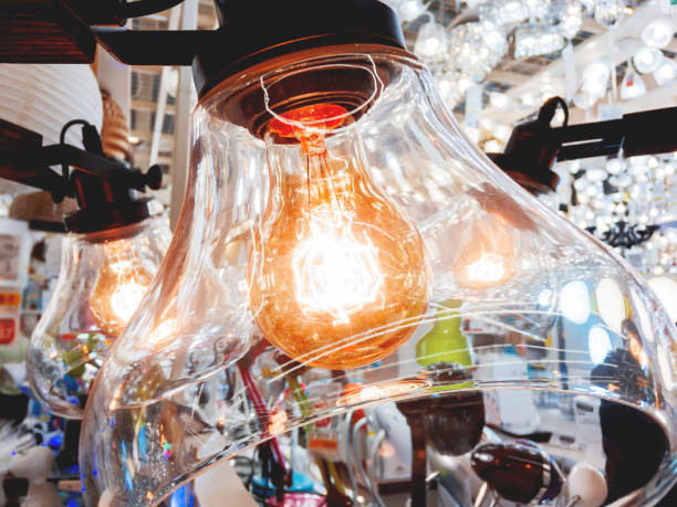 istock Chandelier with old fashioned light bulbs. Vintage light bulbs with glower filament. Incandescent, retro design. 901602398