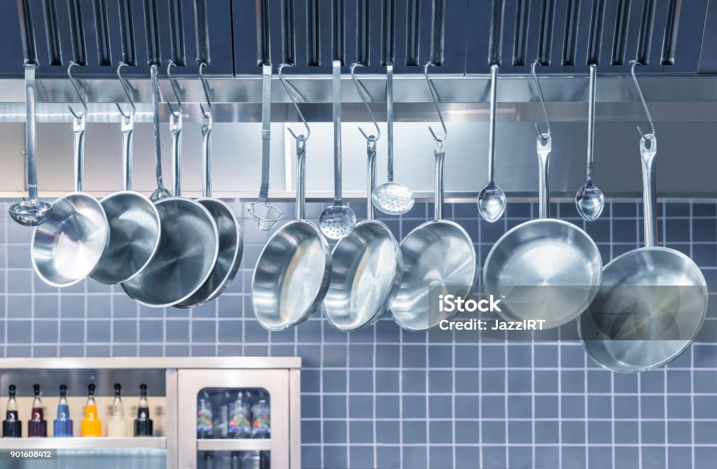 Industrial Kitchen - Pots and tools on shelves Commercial Kitchen Stock Photo