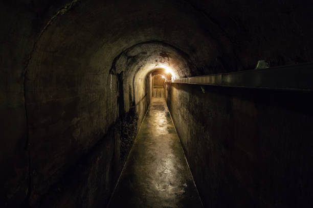 istock Tunnel of old underground Soviet bunker under military artillery fortification 901609174
