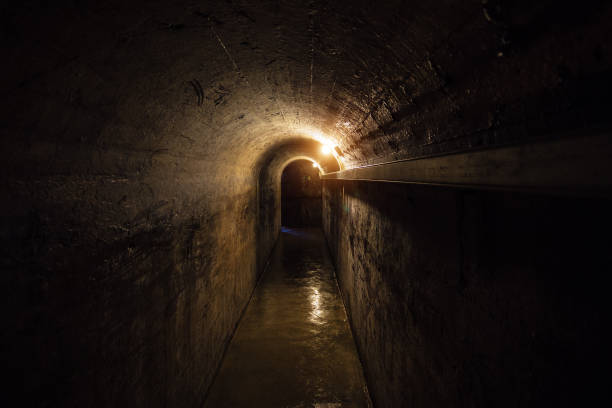istock Dark corridor of old underground Soviet bunker under military artillery fortification 901609288