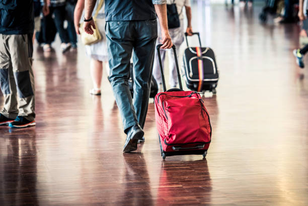 istock Travelers in Airport 901609746