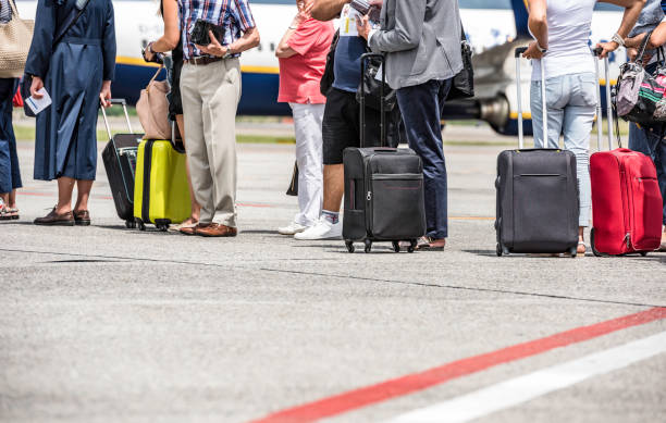 istock Travelers in Airport 901609770