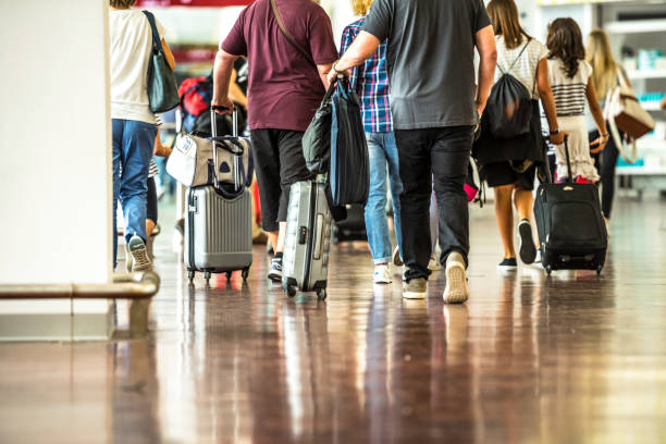istock Travelers in Airport 901609800