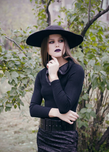 istock Beautiful girl wearing big black hat 901612654