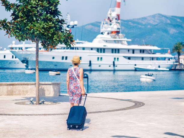istock Woman with suitcase getting ready for her trip 901612874