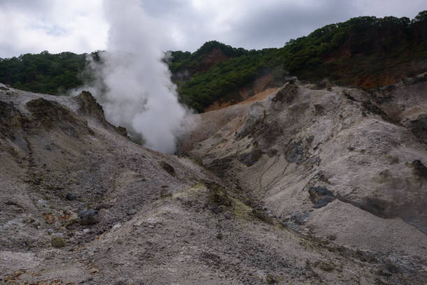 istock Smoke vents escaping from earth’s surface in Hell Valley (Jigokudani) 901614138
