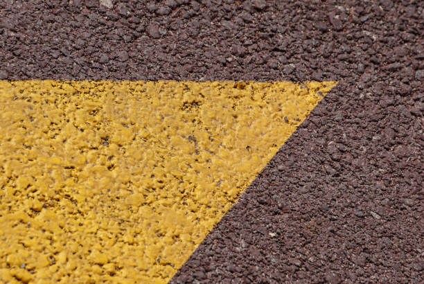 istock Asphalt background texture with some fine grain with Yellow Stripe 901618036