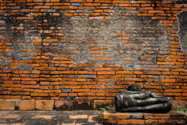 istock Ancient Buddha ruins and old brick wall on ancient monuments that are over 200 years old. Wat Nakhon Luang Tample,Prasat Nakhon Luang public domain or treasure of Buddhism in Nakornluang, Ayutthaya, Thailand 901625560