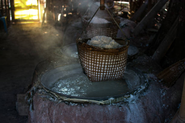istock raditional salt making by boiling underground salt water from natural rocksalt pond in  Bo Kluea village. Nan province, Thailand. 901626312