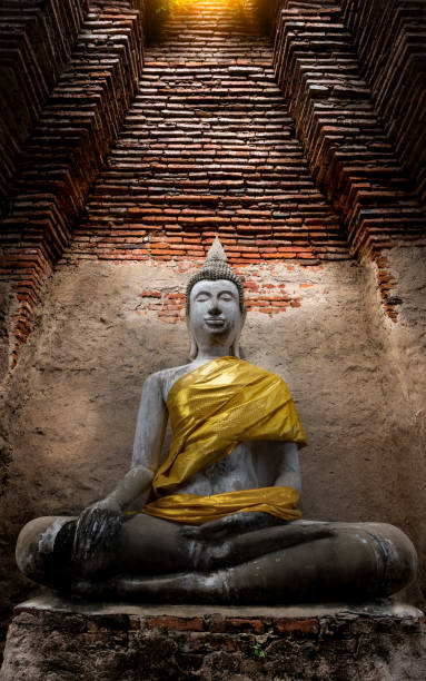 istock Ancient Buddha and old brick wall on ancient monuments that are over 200 years old. Wat Nakhon Luang Tample,Prasat Nakhon Luang public domain or treasure of Buddhism in  Ayutthaya, Thailand 901626946