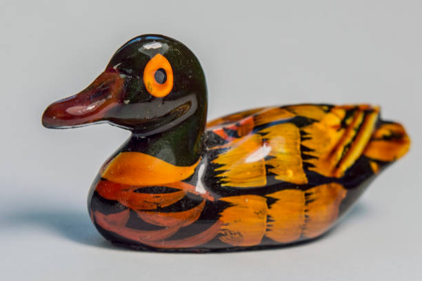 istock Beautifully painted wooden ducky on a white background 901627206
