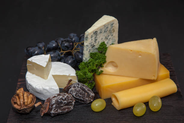 istock Different kinds of cheeses and grapes 901630072