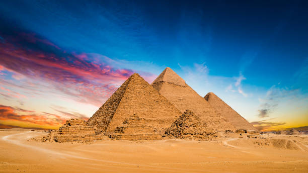 Great Pyramids of Giza Great Pyramids of Giza, Egypt, at sunset giza stock pictures, royalty-free photos & images