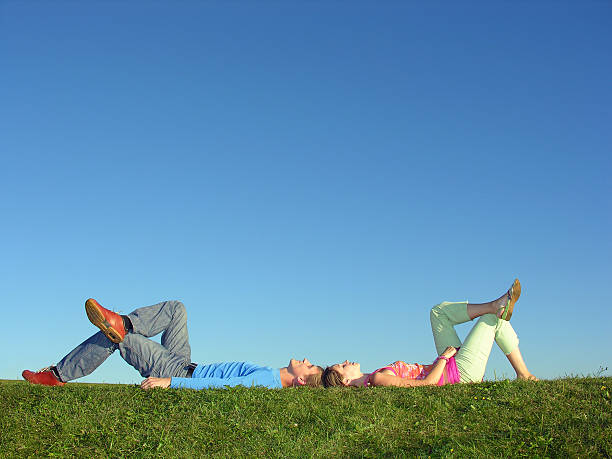 istock man and woman on grass 90163763