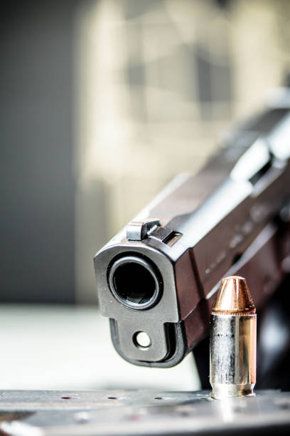 istock Pistol Handgun and Bullets 901643370