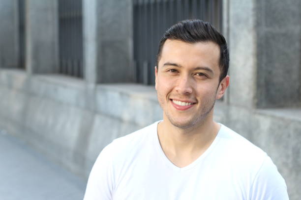 istock Young Hispanic male smiling outside 901643820