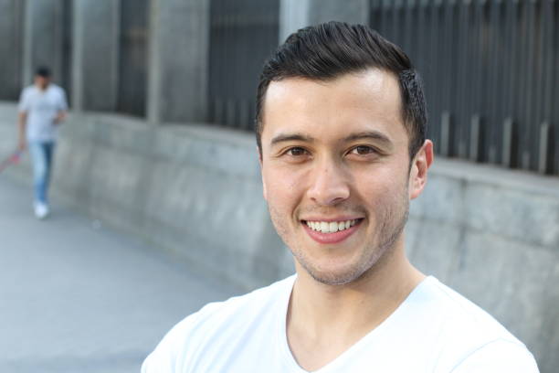 istock Ethnically ambiguous male smiling with copy space 901644044